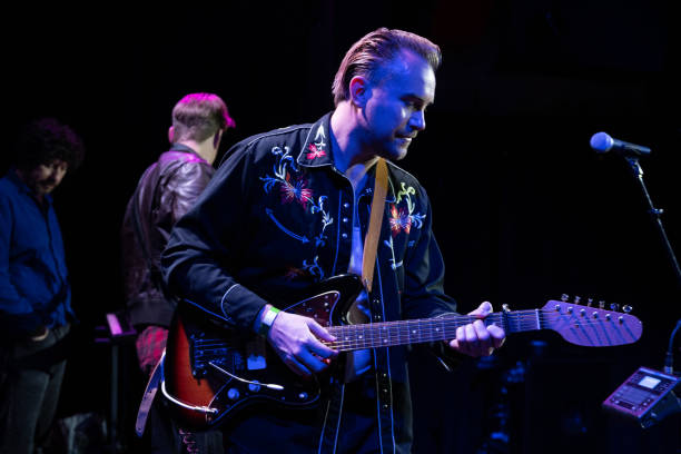 istock Guitarist Conducting Soundcheck On Stage 1464613548