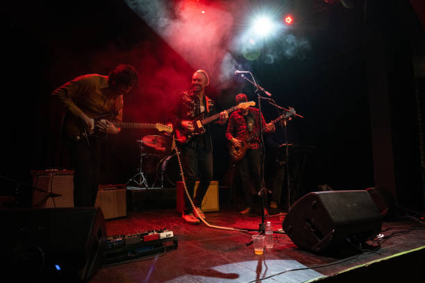 istock Energetic Musicians Performing On Stage 1464613611