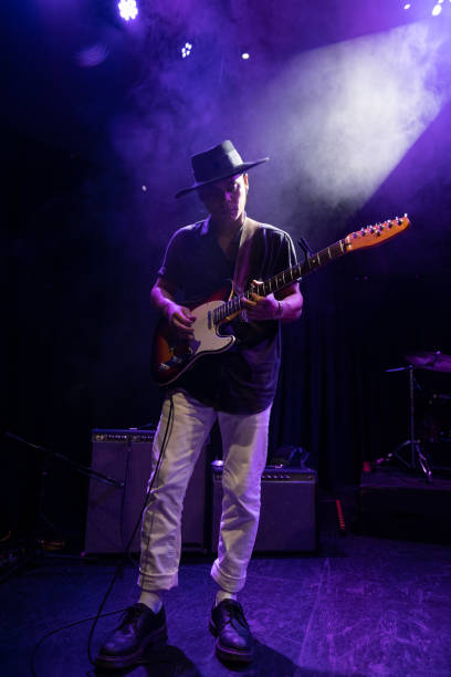 istock Guitarist Performing On Stage 1464613628