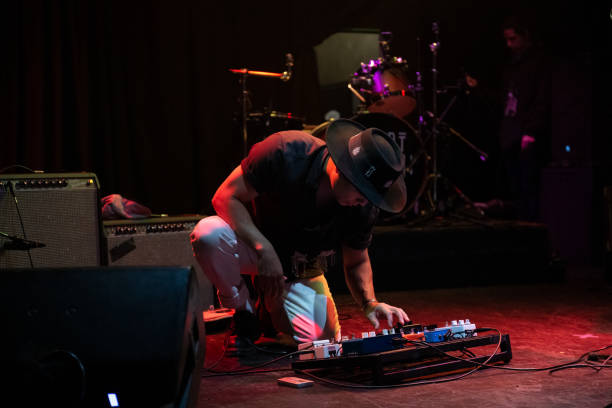istock Musician Adjusting Guitar Pedals 1464613629