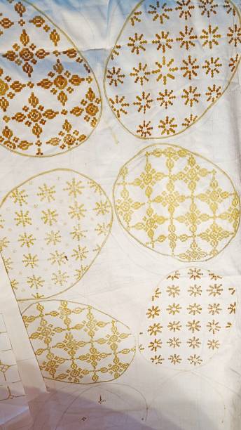 istock The process of coloring batik motifs on white cloth 1464620751