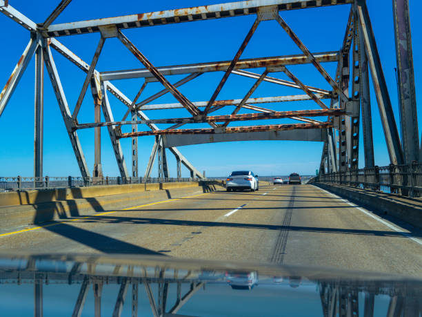 Calcasieu River Bridge, close-up abstract geometry with partial reflections on the car hood, near Lake Charles on Interstate 10 Highway over the Mississippi River in Louisiana, USA stock photo