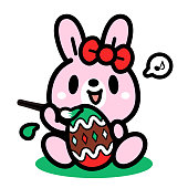 istock A cute Easter Bunny artist painting an Easter Egg 1464627793