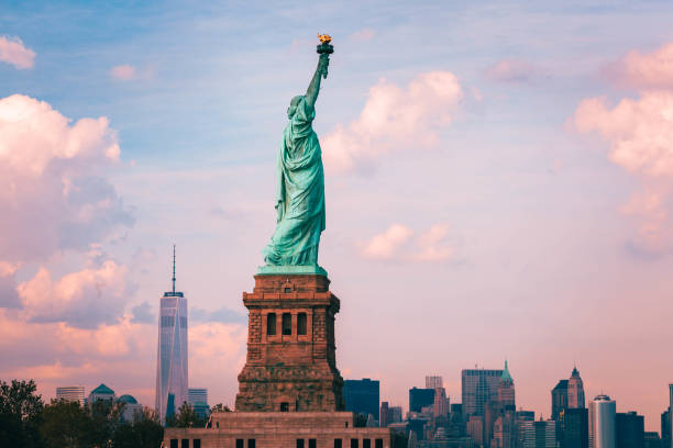 The Statue of Liberty with The Freedom Tower in the Background