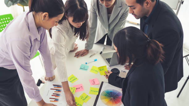 istock Business people proficiently discuss work project on meeting table . Corporate business team collaboration concept . 1464632636