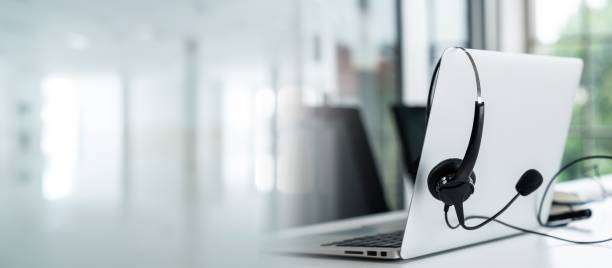 istock Headset and customer support equipment at call center ready for actively service . Corporate business help desk and telephone assistance concept . 1464632681