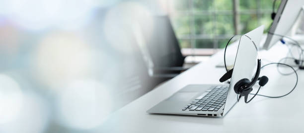 istock Headset and customer support equipment at call center ready for actively service . Corporate business help desk and telephone assistance concept . 1464632695