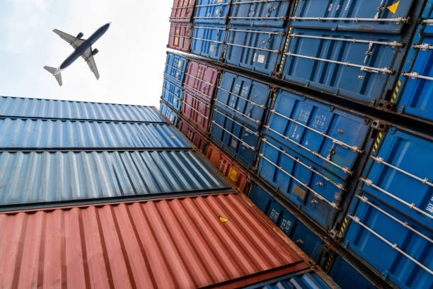 istock Freight airplane flying above overseas shipping container . Logistics supply chain management and international goods export concept . 1464633686