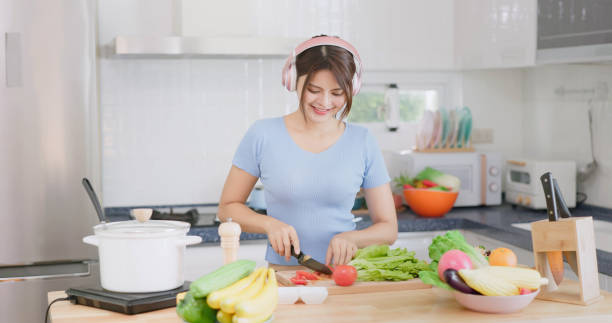 istock Asian girl cooking 1464634299