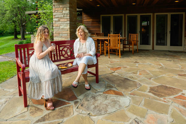 istock People enjoying back patio backyard 1464636273