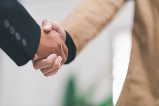 istock businessman shaking hands indicating agreement business, concept progress in development, financial efficiency and investment with business strategy for goals and opportunities in industry future 1464637313