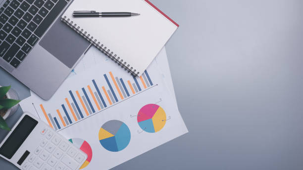 istock Calculators, laptops and notebooks are placed on the table, 1464637388