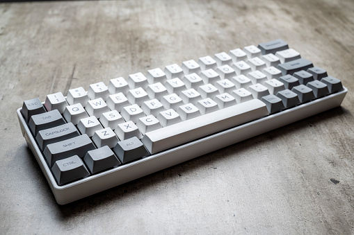 The mechanical keyboard on textured background