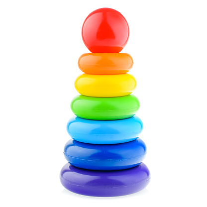 A colored pyramid for a child, isolated on a white background. Educational bright toys for toddlers and babies. The development of motor skills and the study of colors.