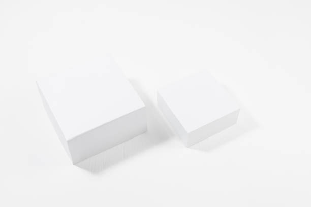 istock Simple modern white stage mockup - two white square podiums in sunlight with shadow on soft light white wood background, top view, template for presentation cosmetic products, goods, branding, design. 1464646554