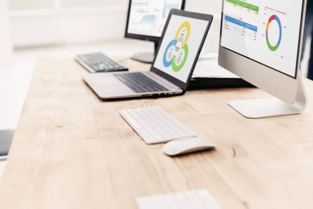 istock background image of computer and laptop on office Desk 1464654694