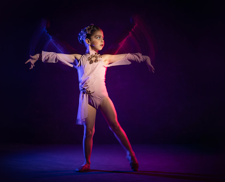 Cuban american ballerina dancing abstraction of colors and movement