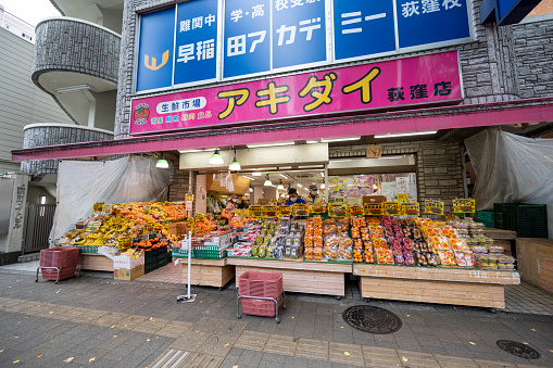 Tokyo, Japan - November 29, 2022 : People at a fresh market in Ogikubo, Suginami, Tokyo, Japan.