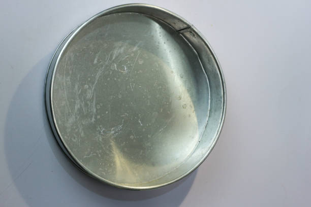 istock Silver aluminum round pie mold isolated on white background 1464657627