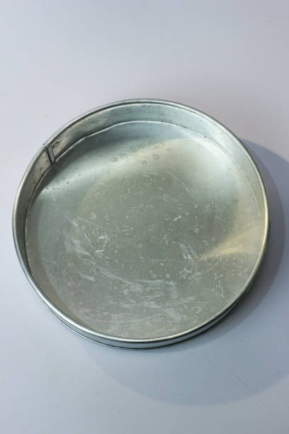 istock Silver aluminum round pie mold isolated on white background 1464657628