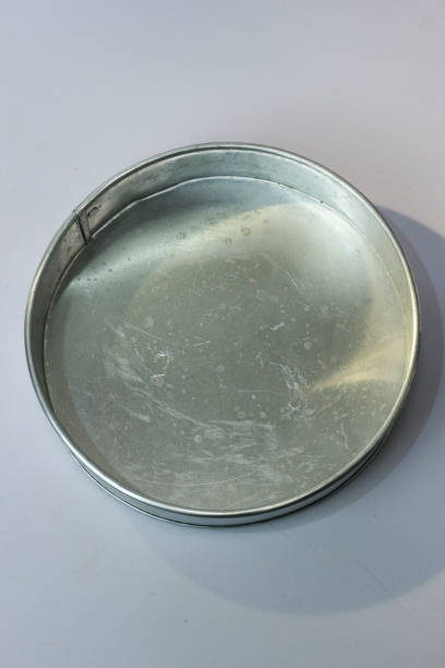 istock Silver aluminum round pie mold isolated on white background 1464657629