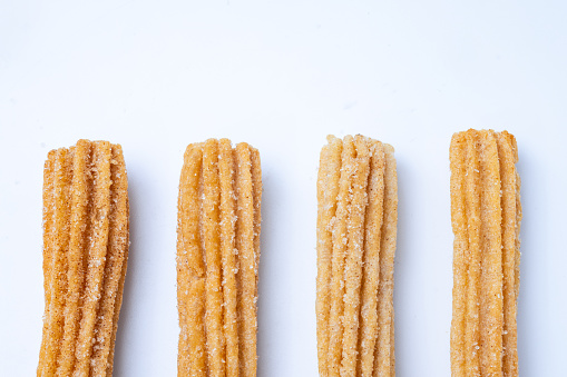 Churros Risers Churros Line Up On A White Table Stock Photo - Download Image Now ...