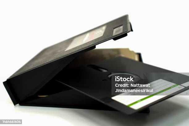 A Closeup Photo Shows Retro Black Floppy Disks And Storage Boxes Used For Computer Storage In The 80s90s On A White Background Stock Photo - Download Image Now