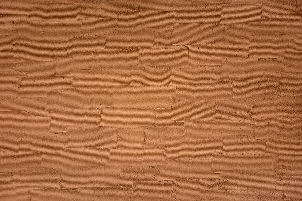 brown concrete wall texture background - color image solid brown bumpy imagens e fotografias de stock