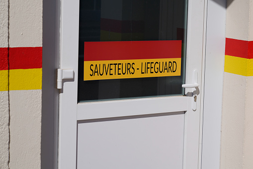 sauveteurs french text means Lifeguard on door entrance hut on Beach