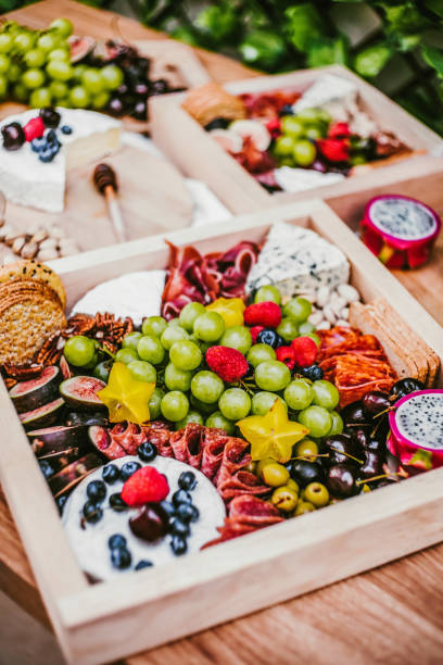 istock Appetizers table with brie cheese, fruit and snacks. Cheese and meat variety board in Mexico Latin America 1464664422