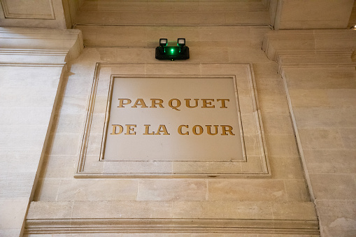 parquet de la cour text sign on ancient wall facade building means in french Court courthouse justice room