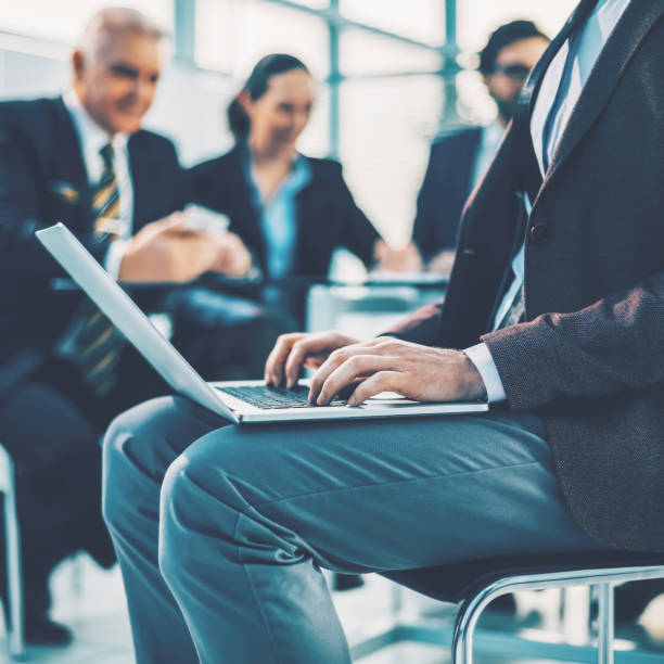 istock close up. businessman using a laptop in the workplace. 1464665519