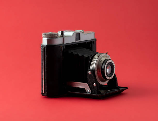 istock Vintage photocamera on red 1464665565