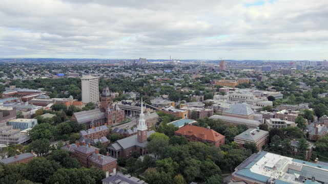 Aerial Panoramic View Of Harvard Yard Outside Memorial Church, Harvard College, And Harvard University Buildings In Cambridge, Massachusetts, USA. pan right