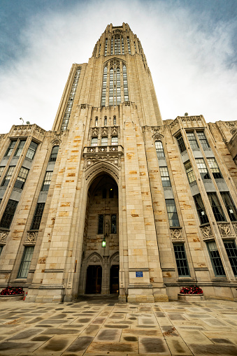 Pittsburgh, Pennsylvania, USA - August 10, 2022: Exterior of the 42 story Gothic Revival styled Cathedral of Learning, a skyscraper centerpiece on the University of Pittsburgh campus.