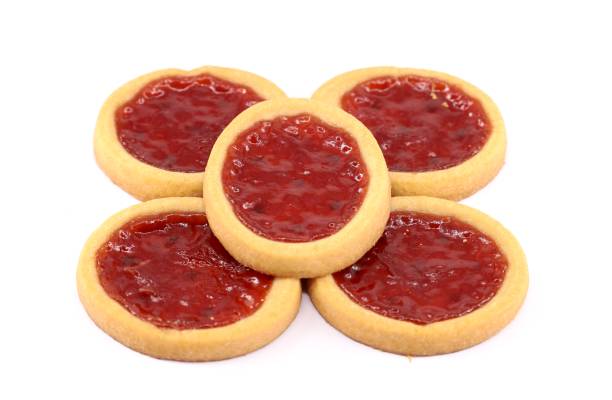 istock Red berry jam tartlets on white background. 1464674152