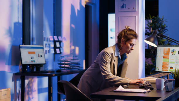 istock Business woman analyzing statistics on monitor 1464676970