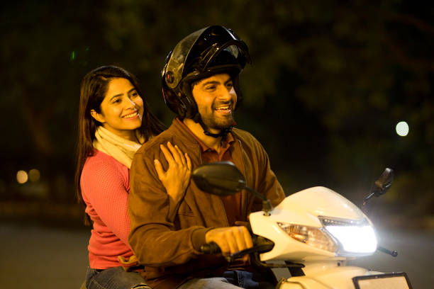istock Happy couple enjoying motorcycle ride at night 1464678765