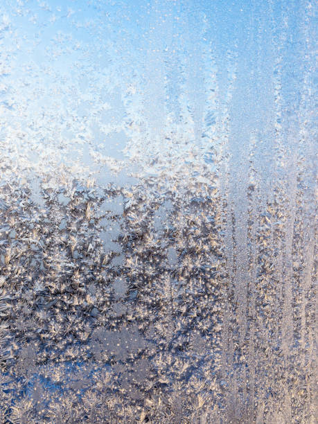 istock frost lit by sun on home window glass in winter 1464678804