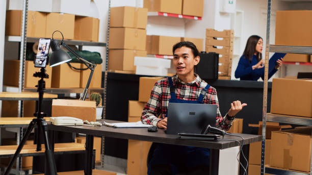 istock Asian worker promoting supplies on online ad video 1464683190