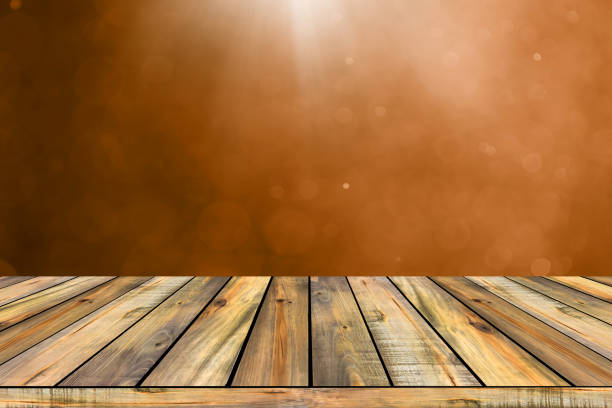 Mock up picnic hardwood table top on  brown defocus  background.