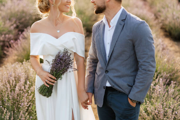 istock bride and groom on in the lavender field 1464684555