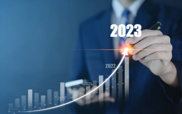 istock Businessman planning 2023 stock analysis strategy showing positive digital technology chart more each year stock growth development concept 1464685496