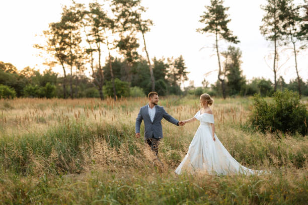 istock bride and groom on in the woods 1464685543