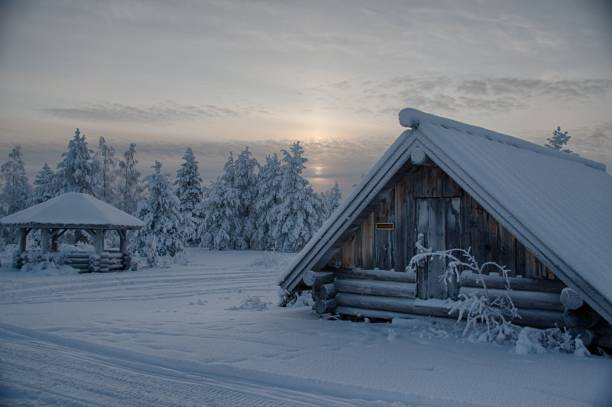 istock Beautiful cloudscape over white snow-covered cottages and fields in the countryside 1464685680
