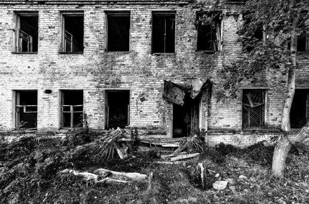 istock Grayscale shot of an old and abandoned building 1464687374
