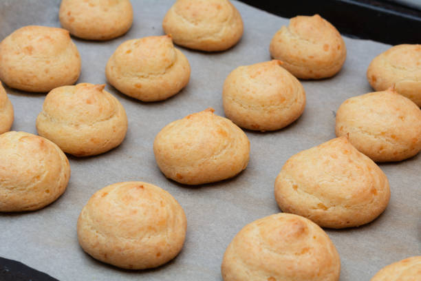 istock French Cheese Puffs. Freshly baked French cheese mini buns, selective focus, shallow depth of field 1464687674