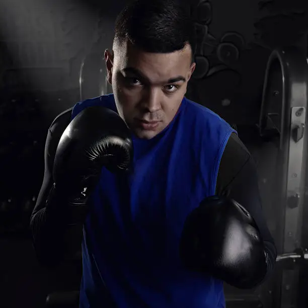 sportsman boxer training with himself in anticipation of the fight positively confident in success tired and contented strong creative photo. High quality photo