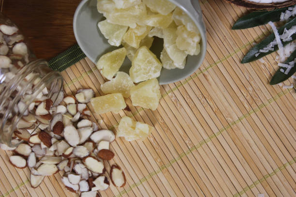istock Sliced almonds and dried pineapple on the bamboo mat 1464688153