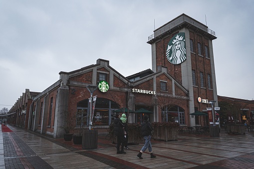 Shanghai, China – January 29, 2022: The Starbucks coffeehouse building in Shanghai International Fashion Center